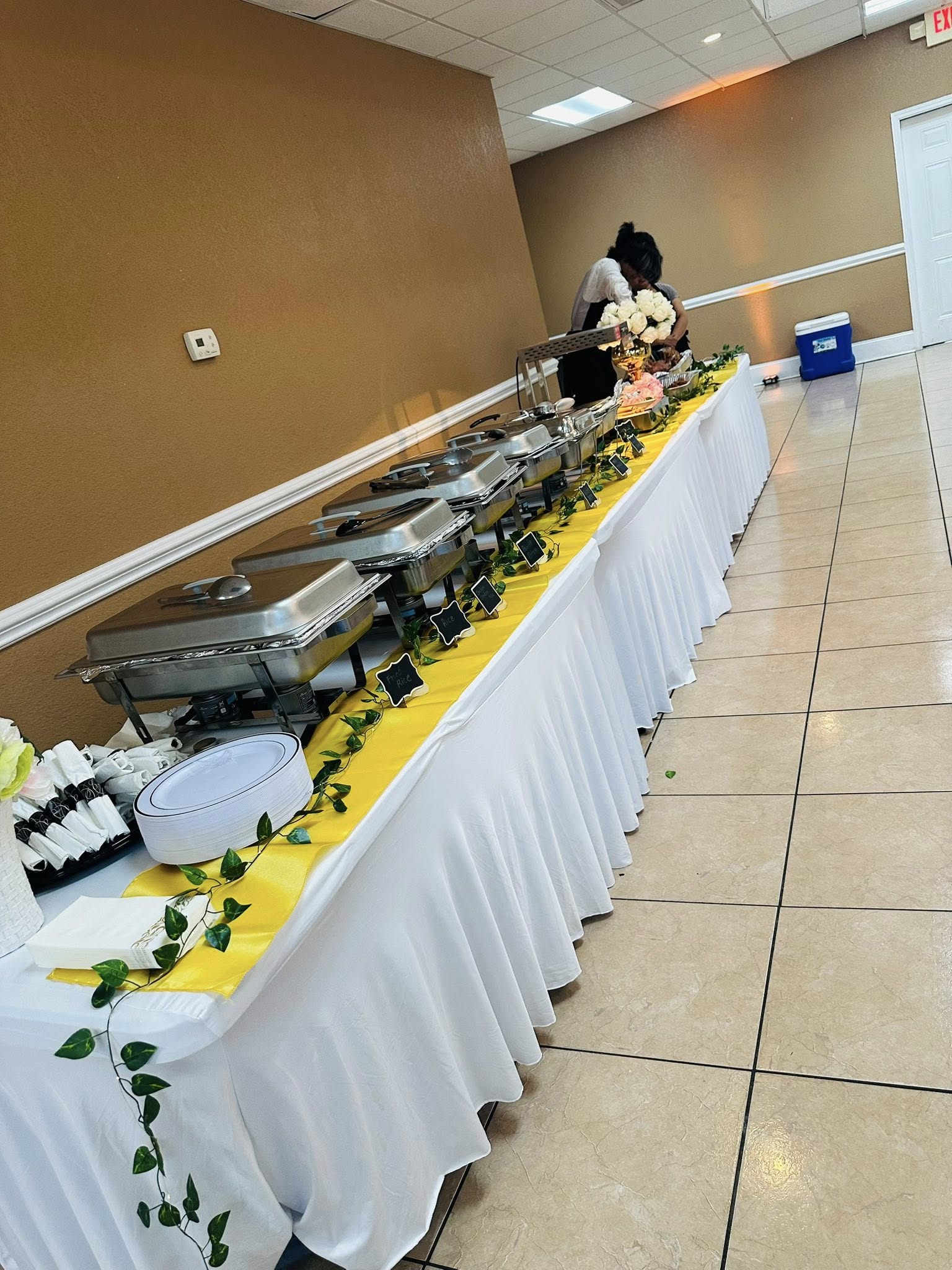 Lor's catering table setup with serving trays for an event